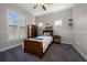 Bright bedroom with wood furniture and window shutters at 667 Richmond Close, Tarpon Springs, FL 34688