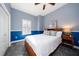 Serene bedroom with blue walls and comfy bed at 667 Richmond Close, Tarpon Springs, FL 34688