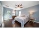 Spacious bedroom with hardwood floors, large bed and plenty of natural light at 667 Richmond Close, Tarpon Springs, FL 34688