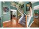 Elegant entryway with hardwood floors and staircase at 667 Richmond Close, Tarpon Springs, FL 34688