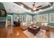 Relaxing Gathering room with comfortable seating and hardwood floors at 667 Richmond Close, Tarpon Springs, FL 34688