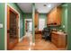 Home office features built-in cabinetry and wine storage at 667 Richmond Close, Tarpon Springs, FL 34688