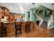 Spacious kitchen with island, stainless steel appliances, and wood cabinets at 667 Richmond Close, Tarpon Springs, FL 34688