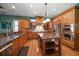 Gourmet kitchen features granite island and stainless steel appliances at 667 Richmond Close, Tarpon Springs, FL 34688