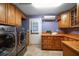 Laundry room with built-in cabinets and storage at 667 Richmond Close, Tarpon Springs, FL 34688