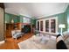 Spacious living room featuring hardwood floors and access to backyard at 667 Richmond Close, Tarpon Springs, FL 34688