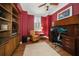 Home office with built-in bookcases and hardwood floors at 667 Richmond Close, Tarpon Springs, FL 34688