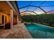 Relaxing pool and spa area with covered patio at 667 Richmond Close, Tarpon Springs, FL 34688