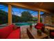 Relaxing covered patio with pool and spa views at 667 Richmond Close, Tarpon Springs, FL 34688