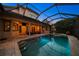 Resort-style pool and spa with covered patio and home views at 667 Richmond Close, Tarpon Springs, FL 34688