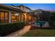 Inviting pool with screened enclosure and walkway at 667 Richmond Close, Tarpon Springs, FL 34688