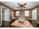 Cozy sitting room with hardwood floors, comfy seating, and large windows at 667 Richmond Close, Tarpon Springs, FL 34688