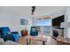 Living room boasts ocean views and a cozy fireplace at 9 Haig Pl # 806, Dunedin, FL 34698