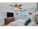 King-size bed, ocean view, and large TV in bedroom at 9 Haig Pl # 806, Dunedin, FL 34698