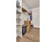 Laundry closet with shelving and wire baskets at 9 Haig Pl # 806, Dunedin, FL 34698