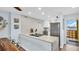 Open kitchen with stainless steel appliances and ocean view at 9 Haig Pl # 806, Dunedin, FL 34698