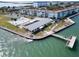 Aerial view of a waterfront community with a clubhouse, pool, and dock at 9 Haig Pl # 806, Dunedin, FL 34698
