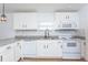 Modern kitchen with white shaker cabinets, granite countertops, and stainless steel appliances at 1616 18Th Street E Ct, Palmetto, FL 34221