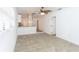 Bright living room with neutral carpet, ceiling fan, and open concept design at 1616 18Th Street E Ct, Palmetto, FL 34221