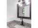 Updated bathroom features granite vanity, modern fixtures, and a frameless shower at 1616 18Th Street E Ct, Palmetto, FL 34221
