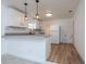 Modern kitchen with white shaker cabinets, granite countertops, and stainless steel appliances at 1616 18Th Street E Ct, Palmetto, FL 34221