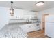 Modern kitchen with white shaker cabinets, granite countertops, and stainless steel appliances at 1616 18Th Street E Ct, Palmetto, FL 34221