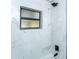Renovated bathroom, featuring marble tile and a shower/tub combo at 1616 18Th Street E Ct, Palmetto, FL 34221