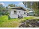 Quaint one-story home with a white exterior and gray accents at 1616 18Th Street E Ct, Palmetto, FL 34221