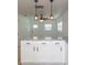 Modern kitchen with white shaker cabinets, granite countertops, and stainless steel appliances at 1616 18Th Street E Ct, Palmetto, FL 34221