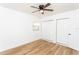 Spacious bedroom featuring wood-look floors, ceiling fan and double closets at 1616 18Th Street E Ct, Palmetto, FL 34221