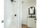 Updated bathroom with marble shower, modern fixtures, and granite vanity at 1616 18Th Street E Ct, Palmetto, FL 34221