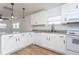 Modern kitchen with white shaker cabinets, granite countertops, and stainless steel appliances at 1616 18Th Street E Ct, Palmetto, FL 34221