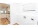 Bright laundry room with vinyl flooring and kitchen access at 1616 18Th Street E Ct, Palmetto, FL 34221