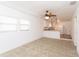 Spacious living room with neutral carpet and ceiling fan at 1616 18Th Street E Ct, Palmetto, FL 34221