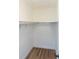 Walk-in closet with wood flooring and ample shelving at 1616 18Th Street E Ct, Palmetto, FL 34221