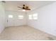 Spacious bedroom with neutral carpet, ceiling fan, and lots of natural light at 1616 18Th Street E Ct, Palmetto, FL 34221