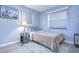 Bright bedroom with double bed and window with blinds at 9252 81St Ave, Seminole, FL 33777