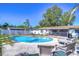 Inviting kidney-shaped pool surrounded by lush landscaping at 9252 81St Ave, Seminole, FL 33777