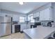 Updated kitchen featuring white cabinets and stainless steel appliances at 9252 81St Ave, Seminole, FL 33777
