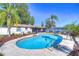 Inviting kidney-shaped pool surrounded by lush landscaping at 9252 81St Ave, Seminole, FL 33777