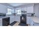 Updated kitchen with white cabinets and stainless steel appliances at 9252 81St Ave, Seminole, FL 33777