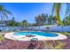Inviting kidney-shaped pool surrounded by lush landscaping at 9252 81St Ave, Seminole, FL 33777