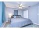 Spacious bedroom with king-size bed and ceiling fan at 9252 81St Ave, Seminole, FL 33777