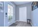 Bright entryway with glass front door, coat closet, and small table at 9252 81St Ave, Seminole, FL 33777