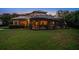 Large backyard with pool and lush landscaping at 667 Richmond Close, Tarpon Springs, FL 34688