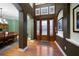 Elegant entryway with hardwood floors, a stained-glass door, and archways at 667 Richmond Close, Tarpon Springs, FL 34688