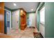Bright entryway with built-in bench and storage at 667 Richmond Close, Tarpon Springs, FL 34688