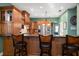 Kitchen boasts a breakfast bar with granite countertops at 667 Richmond Close, Tarpon Springs, FL 34688