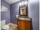 Powder room with vanity and granite countertop at 667 Richmond Close, Tarpon Springs, FL 34688