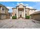 Two-story home with grand entrance, columns and paved driveway at 667 Richmond Close, Tarpon Springs, FL 34688